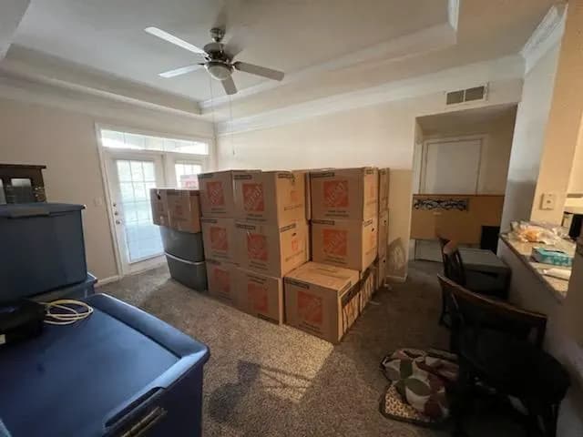 Moving boxes stacked in a room ready for relocation